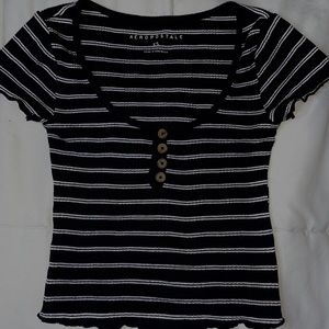 White and black lined U neck shirt